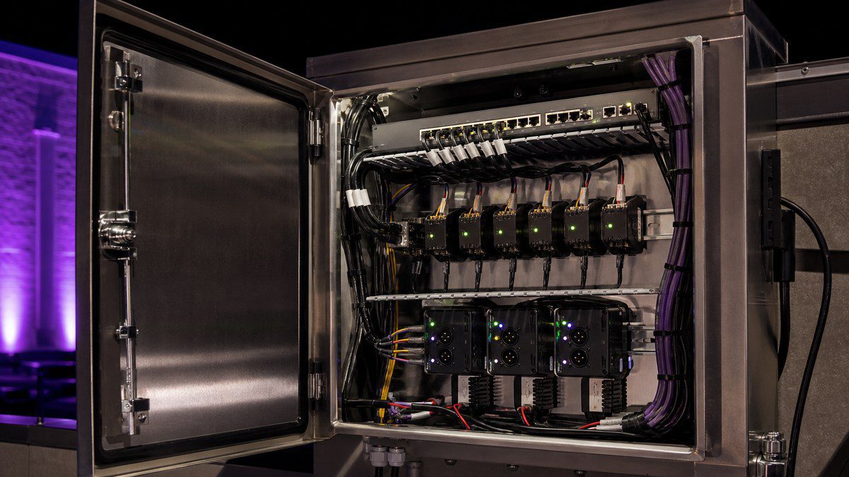 Outdoor lighting control rack with network switch and pixel controllers for a building media facade